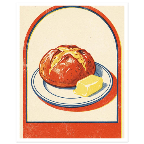 Round loaf and yellow butter on a blue-rimmed plate, with an orange-red arch border and textured cream background.