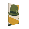 Green hat with a shamrock and dark band, surrounded by mustard geometric shapes and green leaves on a cream background.