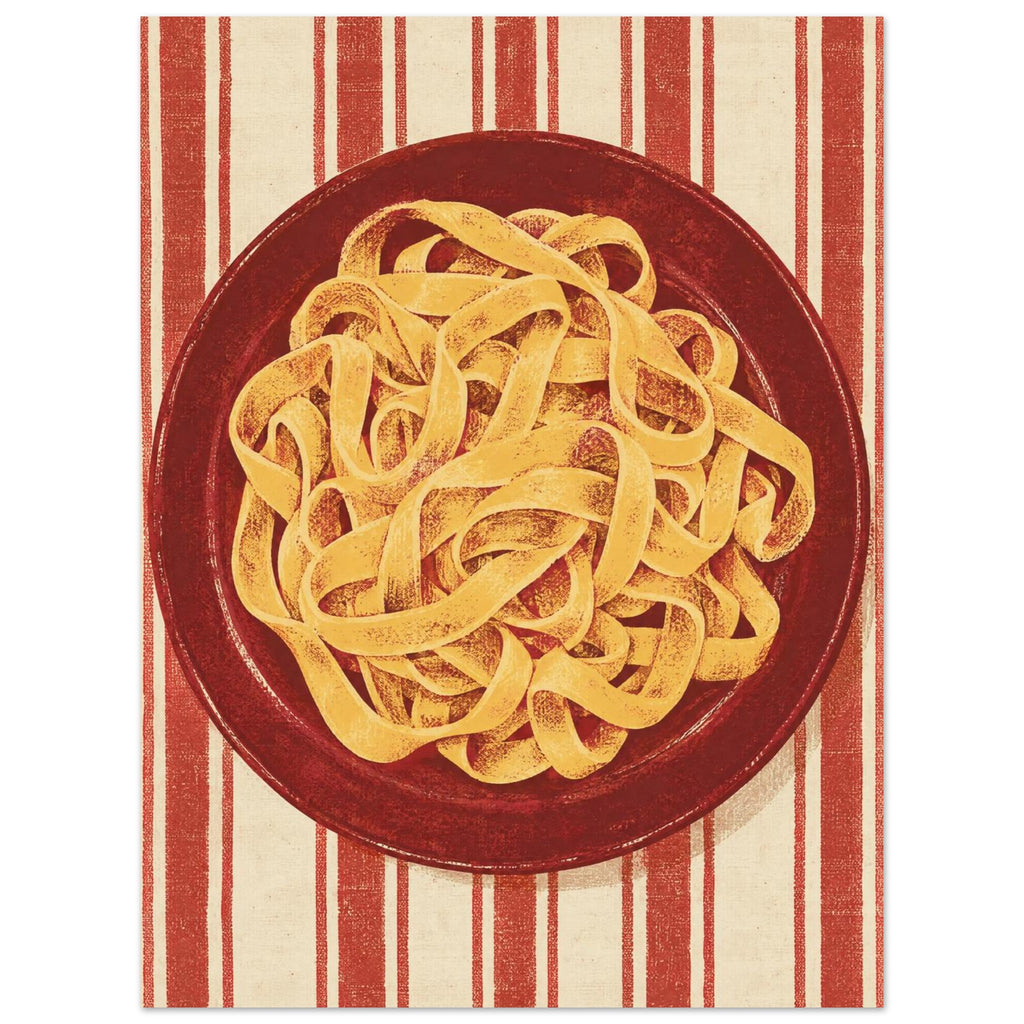 Golden pasta ribbons on a deep red plate, viewed from above against textured red and cream vertical stripes.