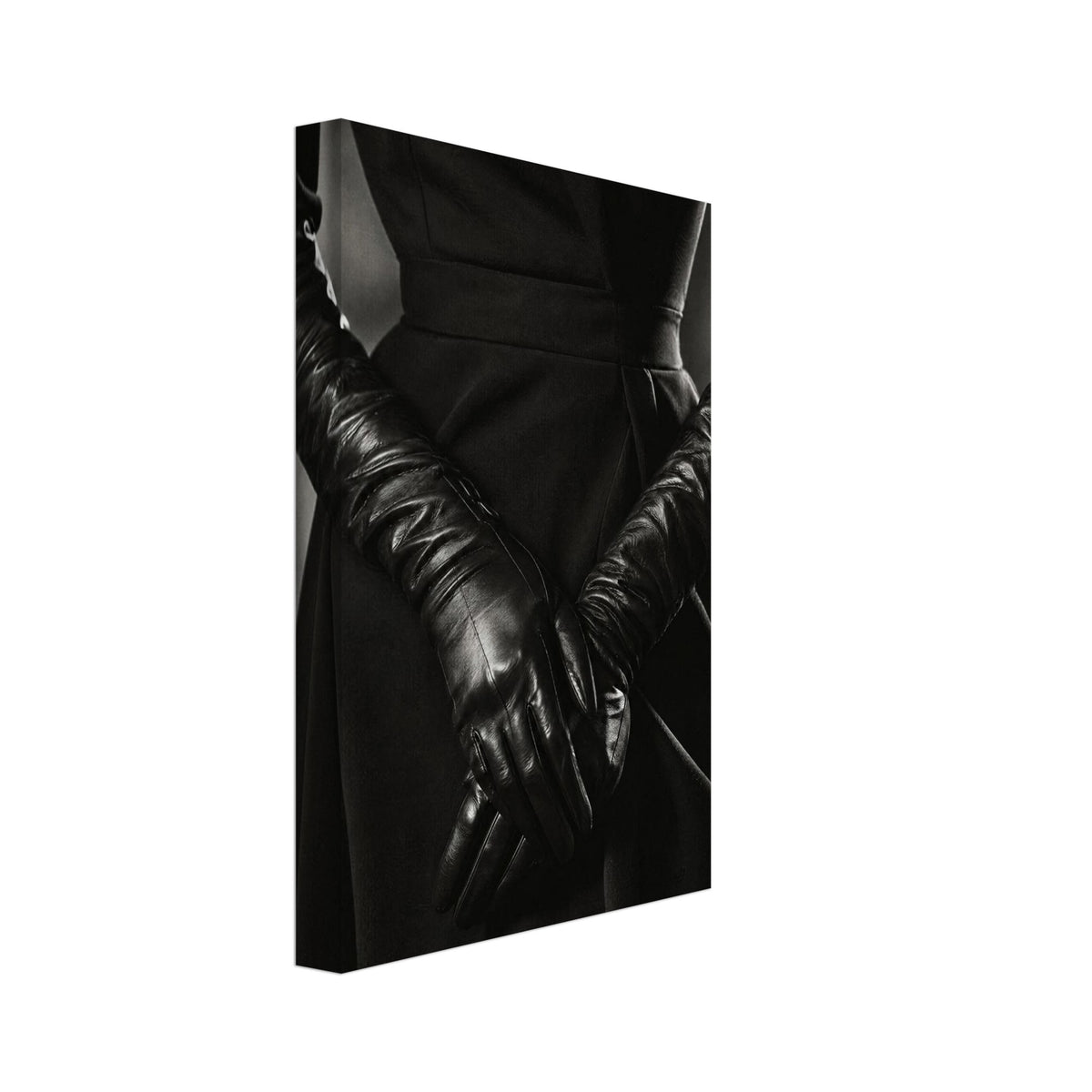 Overlapping hands in long black leather gloves against a dark fitted outfit, photographed in black and white.