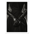 Overlapping hands in long black leather gloves against a dark fitted outfit, photographed in black and white.