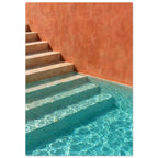 Stone steps descending into turquoise pool water beside a terracotta wall, with sunlight rippling across submerged stairs.