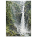 Waterfall cascading between grey rocky cliffs, surrounded by green forest, drifting mist and a boulder-strewn stream.