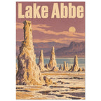 Lake Abbe poster with cream lettering, golden rock spires, a blue lake and distant mountains beneath a dusty rose sky.