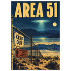 Area 51 poster with yellow lettering, a glowing UFO, desert mountains and a barbed-wire fence bearing warning signs.