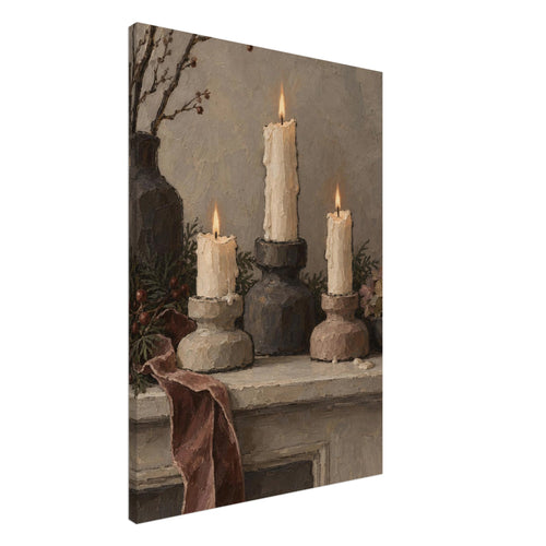 Three lit ivory candles on chunky holders, with a dark vase, branches, greenery and a draped burgundy ribbon.