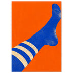 Blue sock with three cream stripes stretching diagonally across an orange background, with a distressed texture.