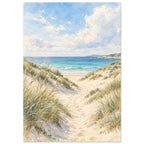 Sand dunes with grasses and footprints leading to turquoise waves beneath a blue sky with soft white clouds.