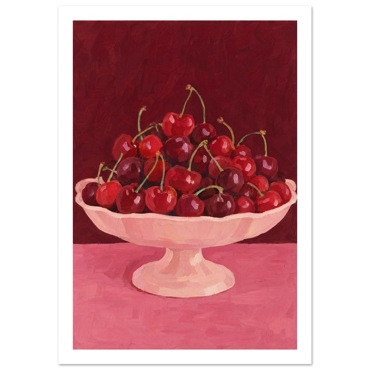 Red and burgundy cherries in a pale pink pedestal bowl on a pink tabletop against a deep red painted background.