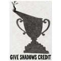 Small flower vase casting a large trophy-shaped shadow above bold lettering reading ‘GIVE SHADOWS CREDIT’.