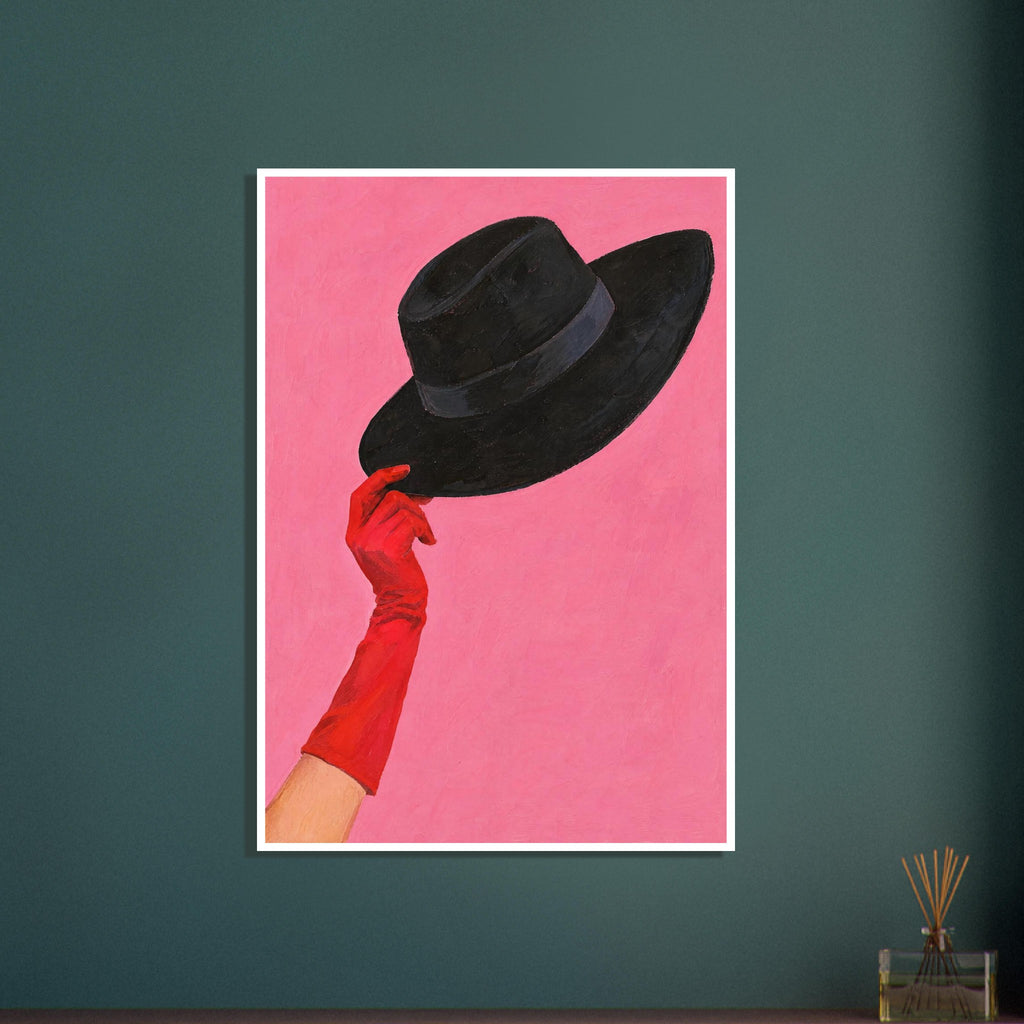 Red-gloved hand lifting a wide-brimmed black hat against a textured pink background.